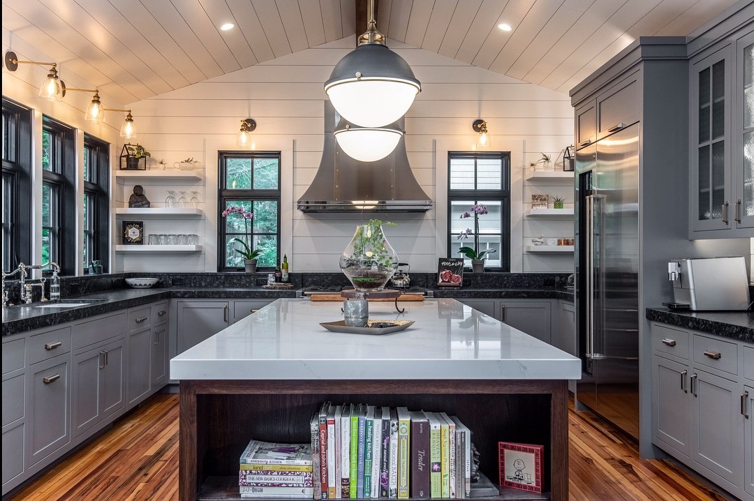 black windows, white walls, and dark gray cabinets create contrast in rustic style kitchen
