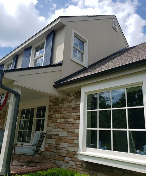 exterior of home white old windows before replacement