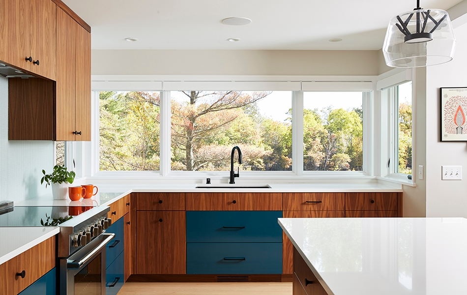 Mid-century modern kitchen in Minnesota home with newly installed Pella wood windows.
