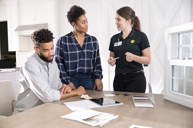 pella saleswoman talking to couple about window choices for their home