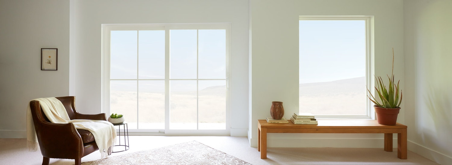 interior of living room with white vinyl sliding patio door