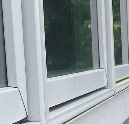 window damage due to hail on an Omaha home window exterior