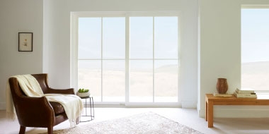 interior of living room with white vinyl sliding patio door