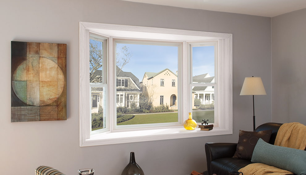 a white bay window unit on a gray-painted wall when viewed from the interior