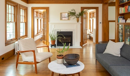 clean and traditional living room with wood double-hung windows and doors