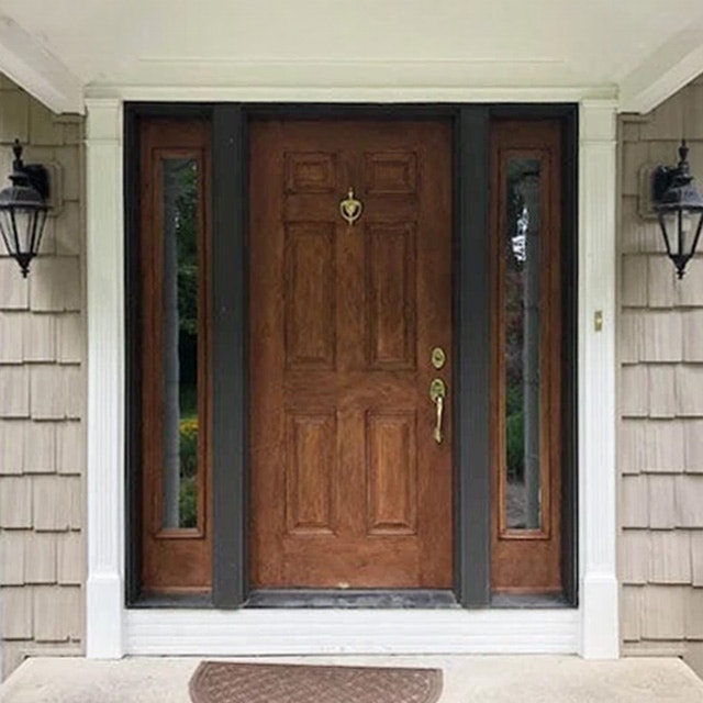 Before image of an outdated front door on Bedford home.