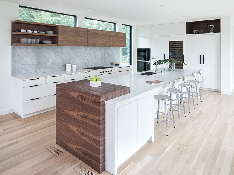 two clerestory windows over a minimalist wood cupboard