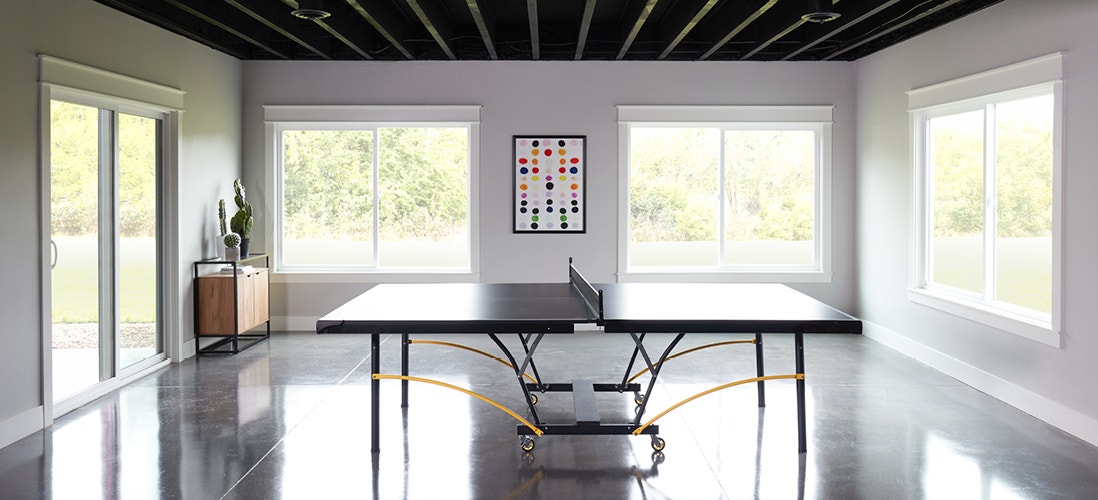 250 series sliding windows in a family rec room ping pong table