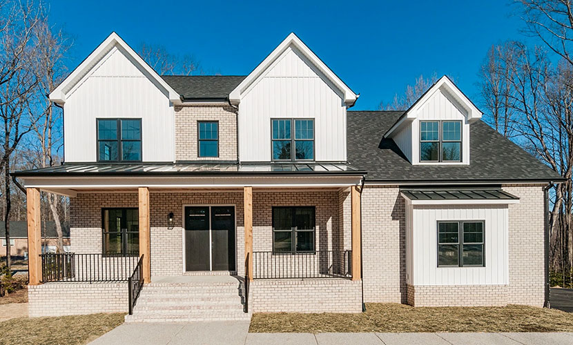 Newly constructed home in Midlothian with modern black windows and front door.