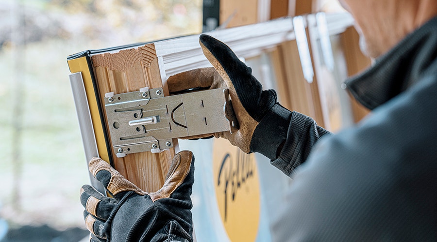 a close shot of a wood casement window featuring the new Steady Set installation system.