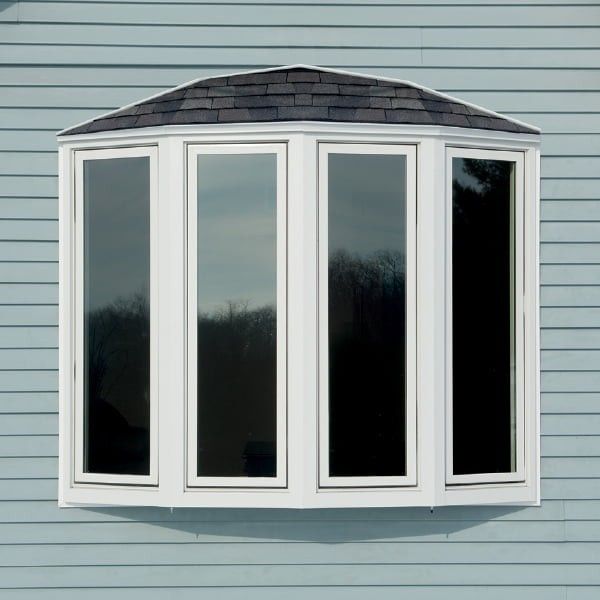 Exterior of white bow window with reflective glass windows