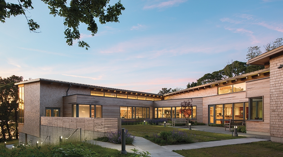 Exterior image of Eastham library addition highlighting Pella wood windows.