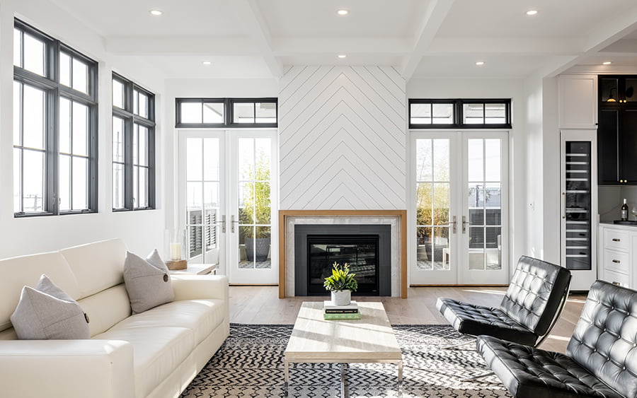 two sets of white french doors complete a modern living room
