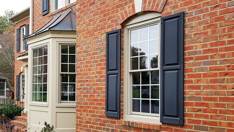 Glen Allen home highlighting traditional grilles and window shutters.