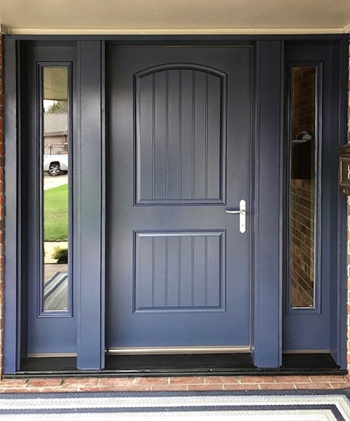 A 2 panel arch front door with full light sidelights with chrome hardware