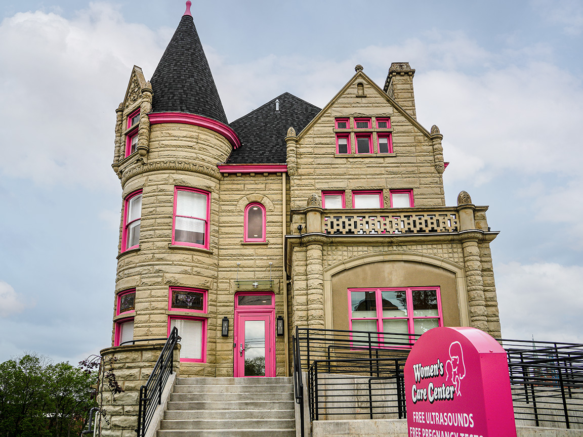 A historic commercial building with pink Pella Reserve windows in Cincinnati, OH.