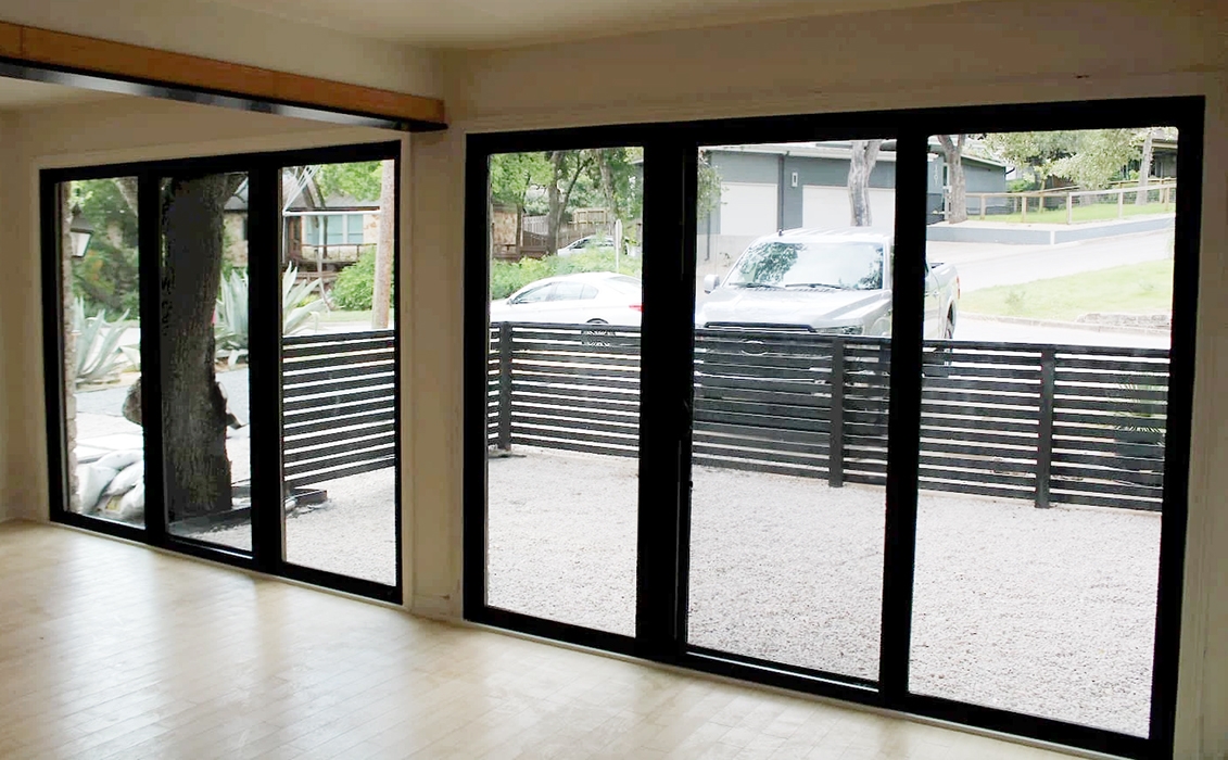 Interior view of triple sliding glass doors in Austin garage.