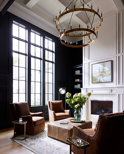 Fixed windows in a dark study brighten up the space. 