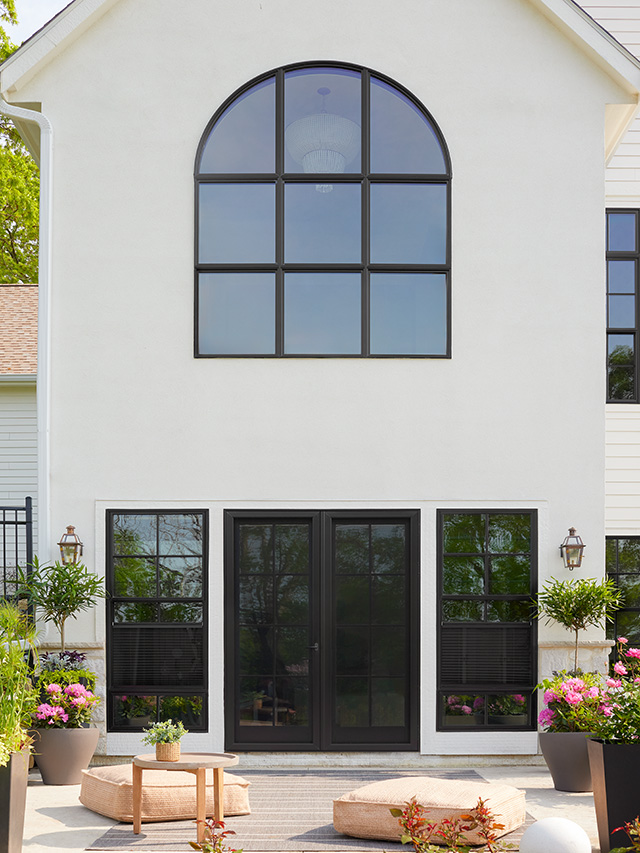 arched-black-window-modern-home-flowers.jpg