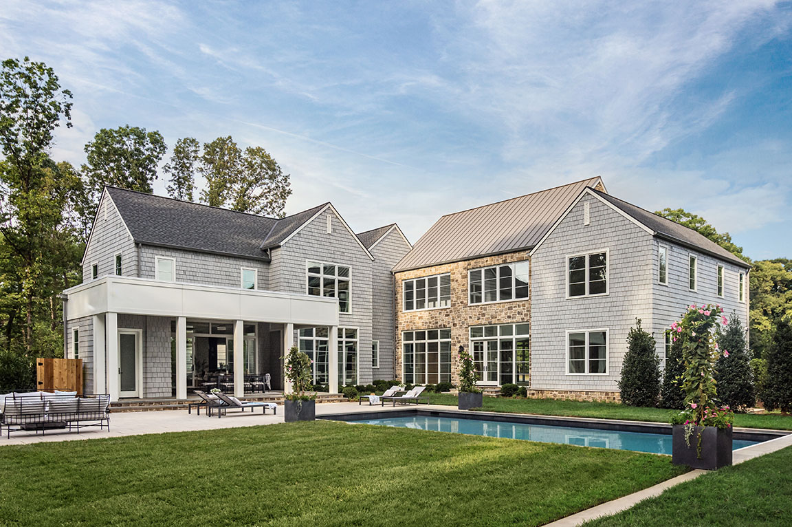 Backyard of Vienna home with newly installed Pella windows creating a seamless indoor-outdoor flow.