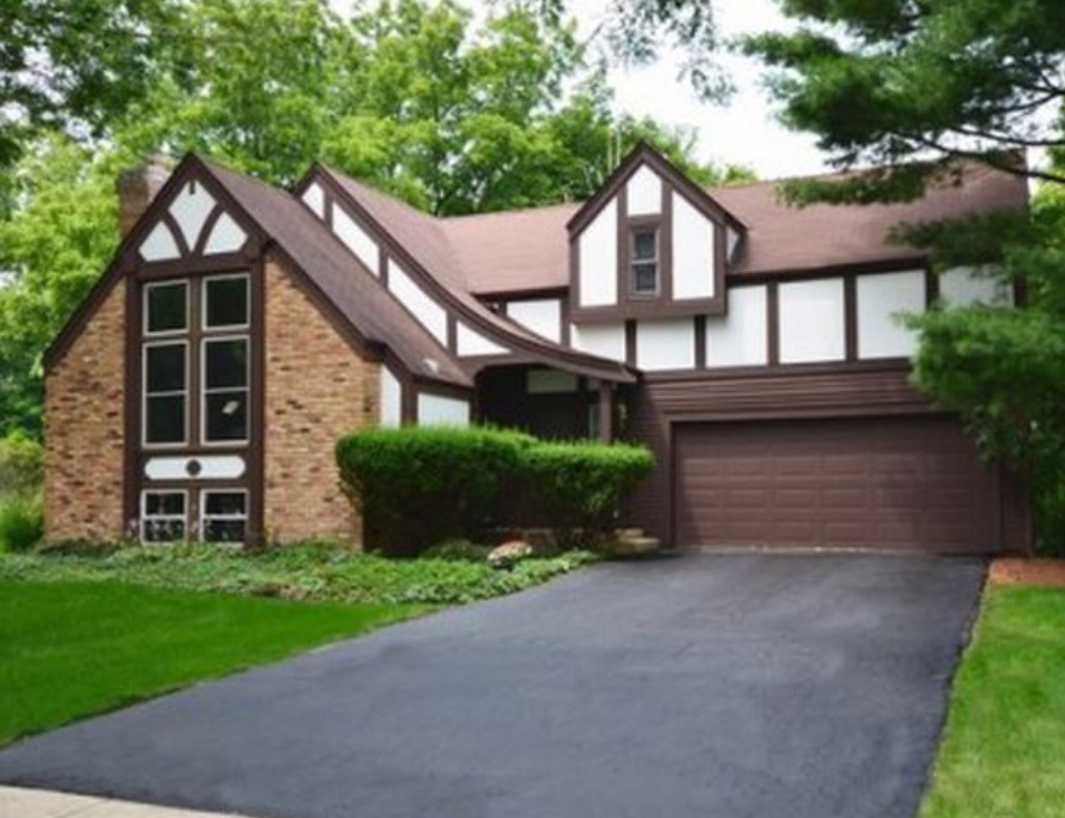Before - Tudor Style Home With Old Brown Windows two story brown and white tudor style home with brown windows