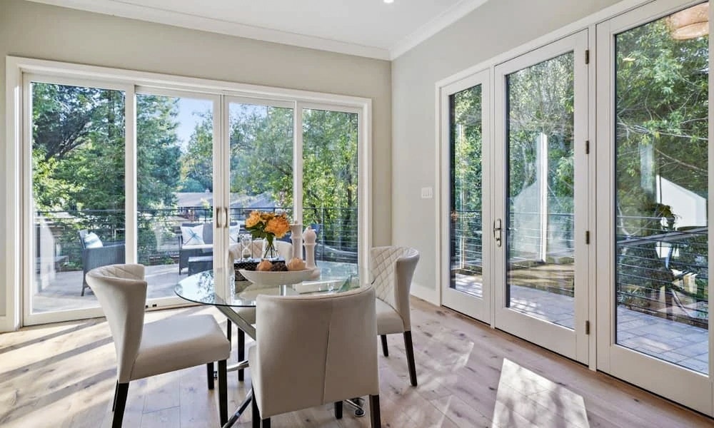 Hillsborough dining room with new wood windows and patio doors installed by Pella.