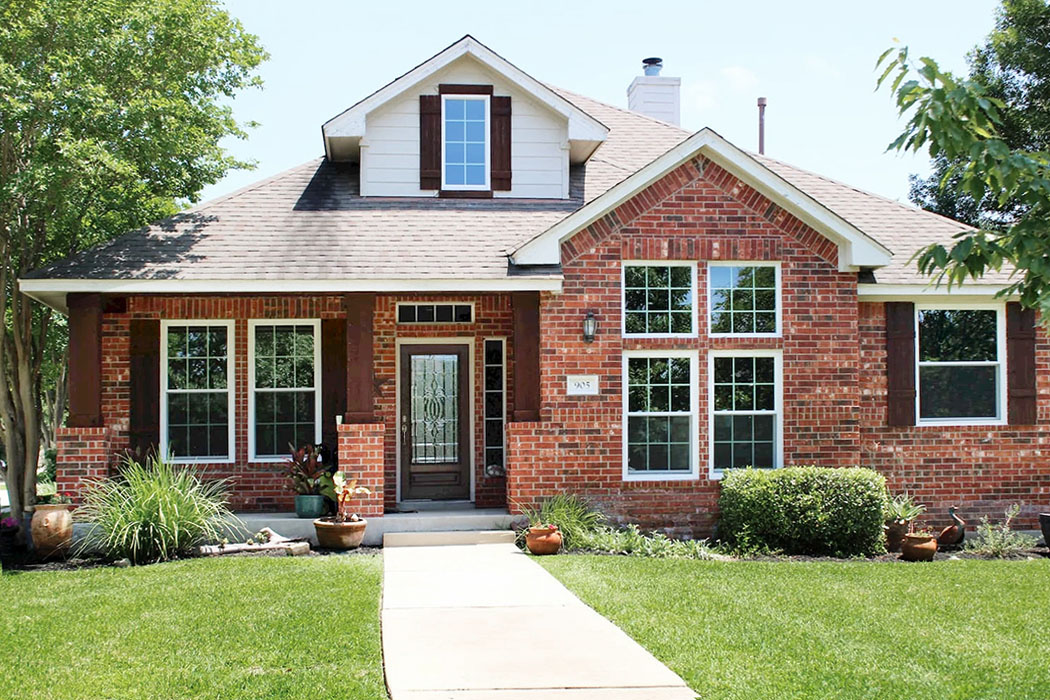 Curbside image of Avery Ranch home with newly replaced Pella windows.
