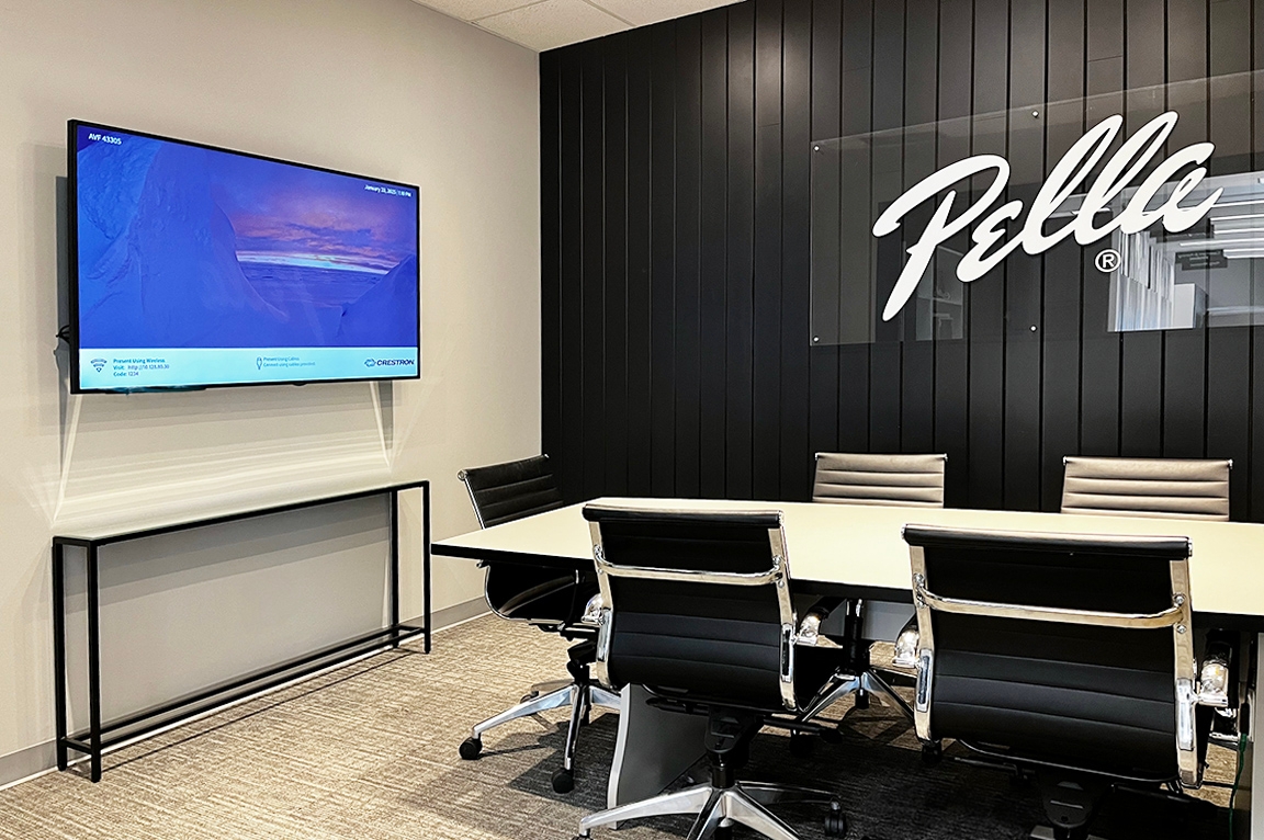 Oakville showroom featuring a large conference room for client meetings with a screen.
