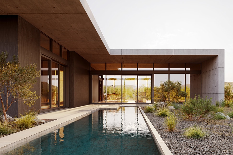 A modern contemporary home with a large stone overhang surrounds a small wading pool.