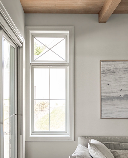 White casement window lets in natural light in living room. 