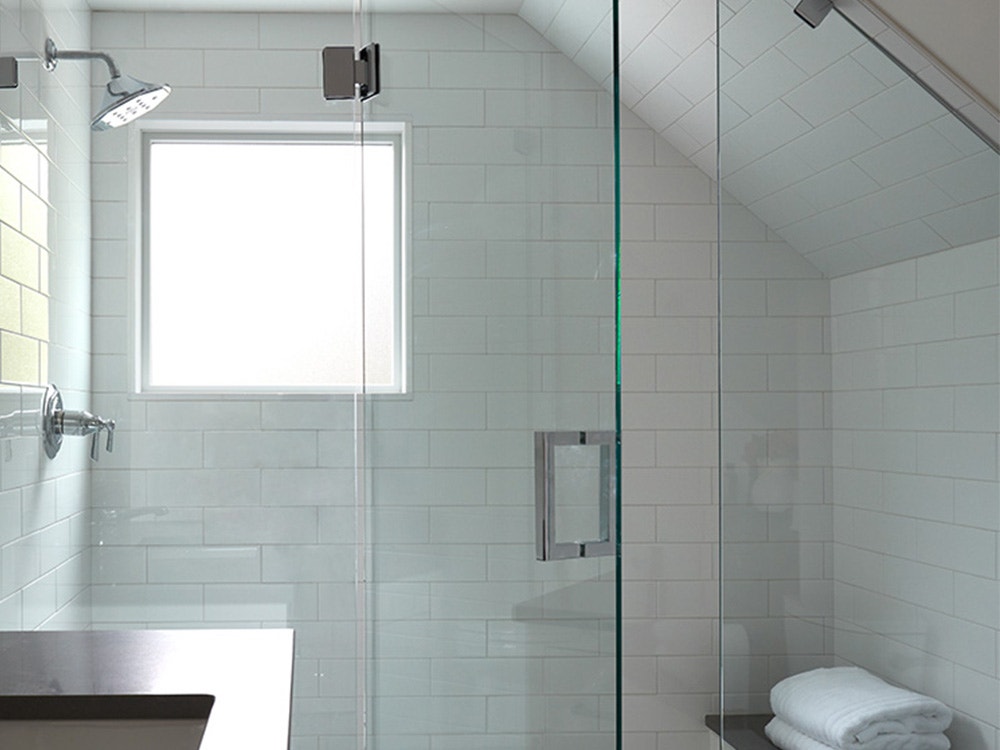 fixed window adds light to a modern bathroom design