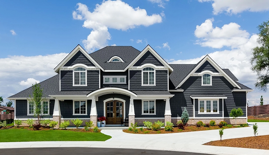 Curbside view of gray Meridian home with new Pella Impervia fiberglass windows.
