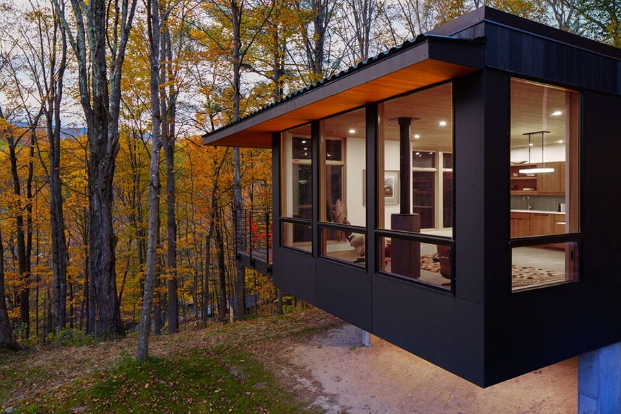 Exterior view of modern Mad River guesthouse with newly installed windows. 