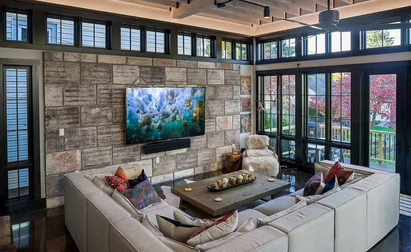 Boalsburg home sunroom with black framed windows and patio door.