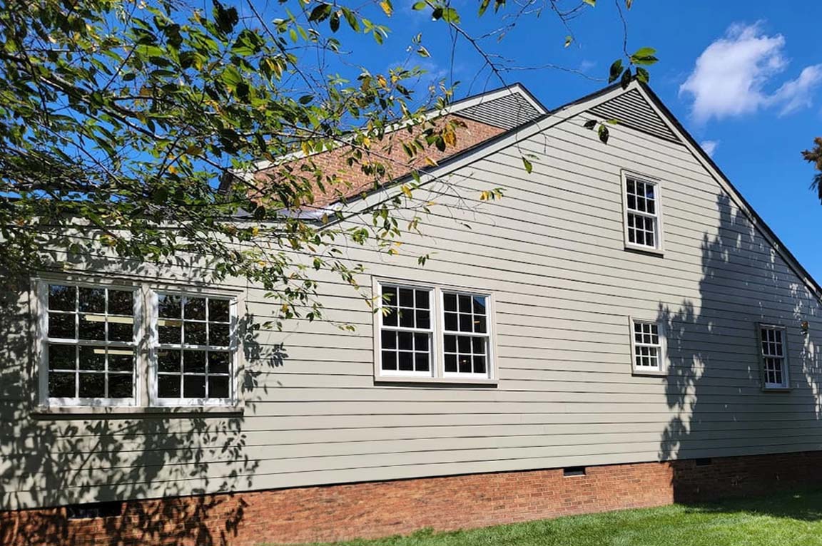 Backyard of Henrico colonial home with newly replaced windows.