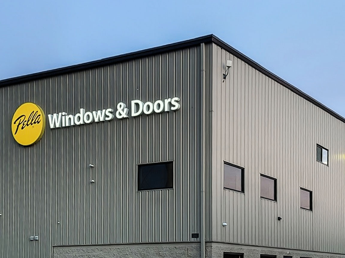 Exterior of a Pella Windows & Doors commercial building with branded signage.