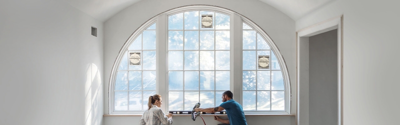 contractor standing by windows
