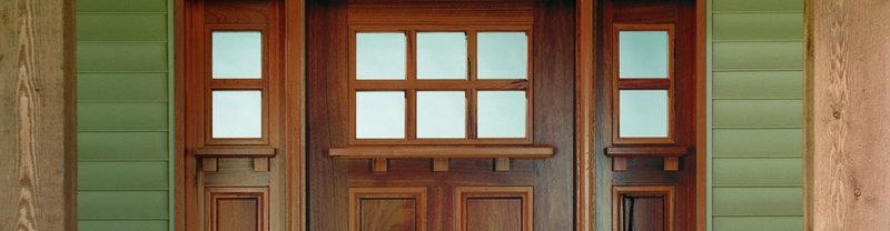 wood entry door with 2x4 grilles and 1/4 light sidelights
