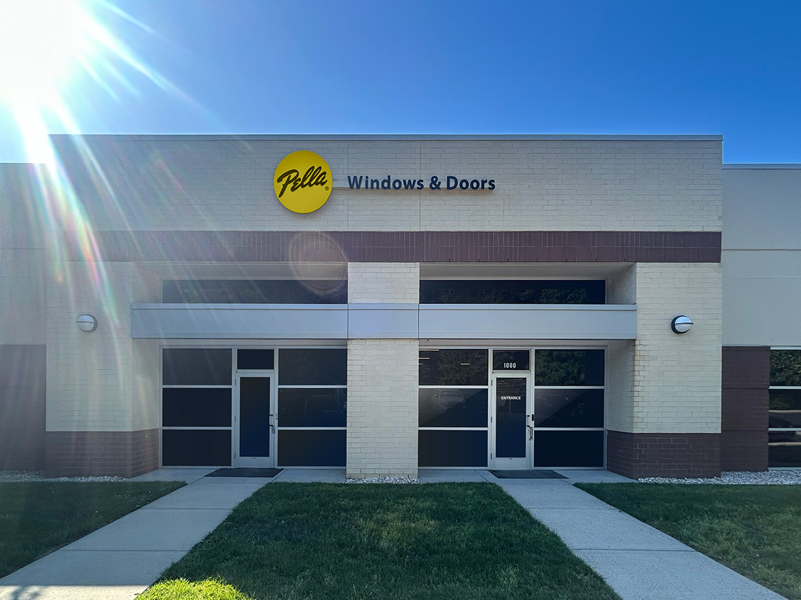The exterior of Pella Windows & Doors Charlotte showroom featuring a modern design and clear signage.