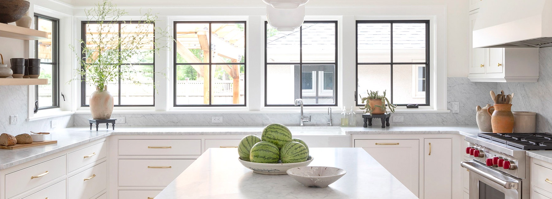 a newly renovated contemporary kitchen featuring four casement windows