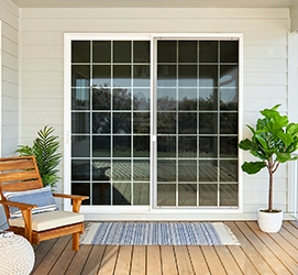 encompass sliding patio door on a back deck with traditional grilles
