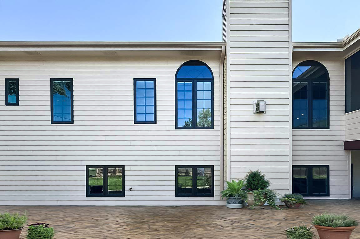 Exterior view of home after window replacement.