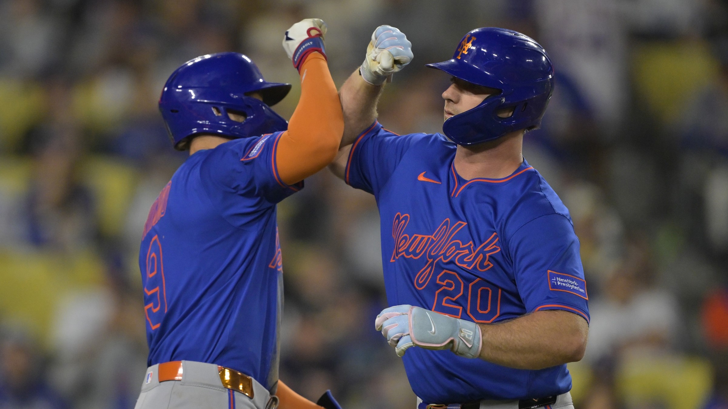 Jun 4, 2025; Los Angeles, California, USA; New York Mets first baseman Pete Alonso (20) is greeted by left fielder Brandon Nimmo (9) after hitting a three run home run in the eighth inning against the Los Angeles Dodgers at Dodger Stadium.