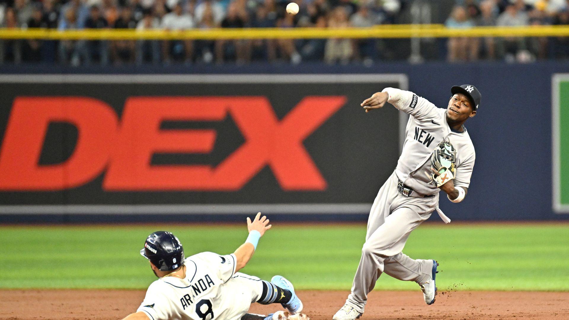 Jonathan Aranda sliding as the Yankees defend during Rays versus Yankees 2026 ALDS Game 2 at Tropicana Field