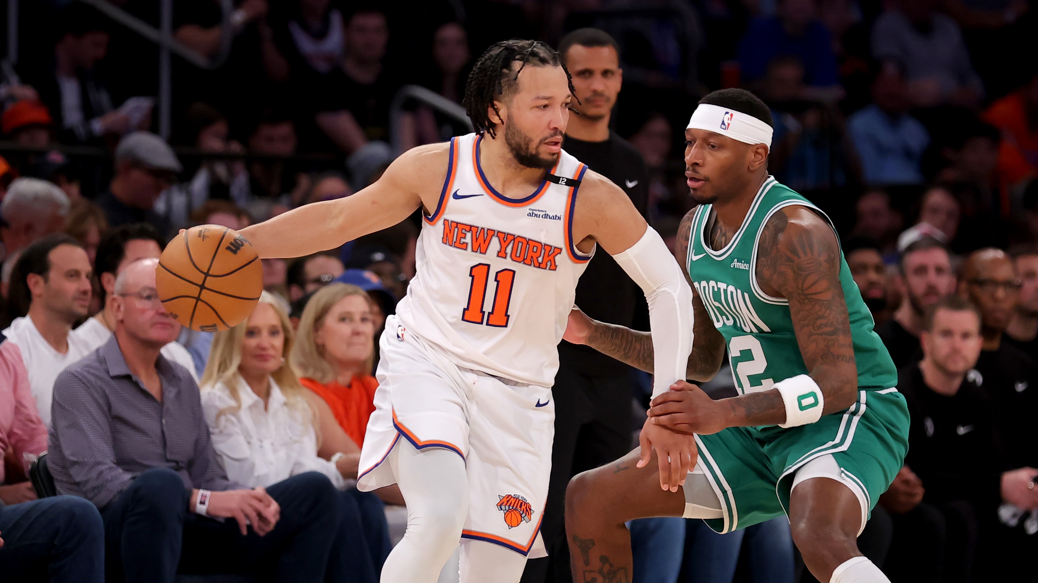 May 16, 2025; New York, New York, USA; New York Knicks guard Jalen Brunson (11) controls the ball against Boston Celtics forward Torrey Craig (12) during the fourth quarter of game six in the second round of the 2025 NBA Playoffs at Madison Square Garden. Mandatory Credit: Brad Penner-Imagn Images