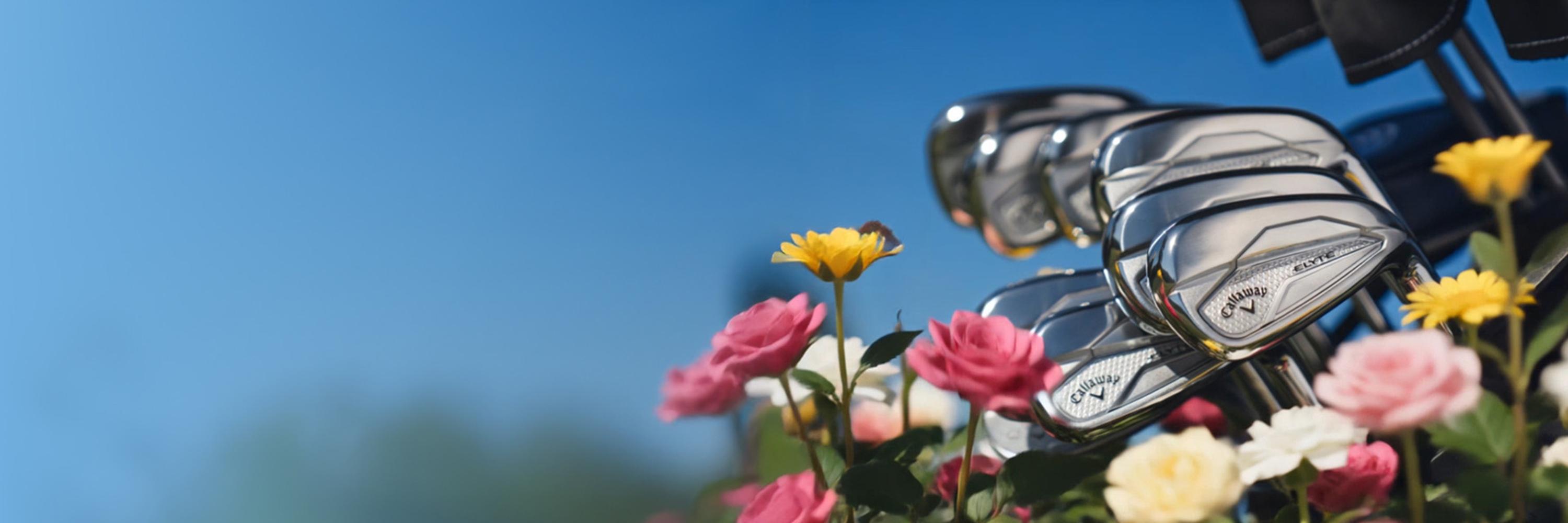 elyte iron club with flowers on turf