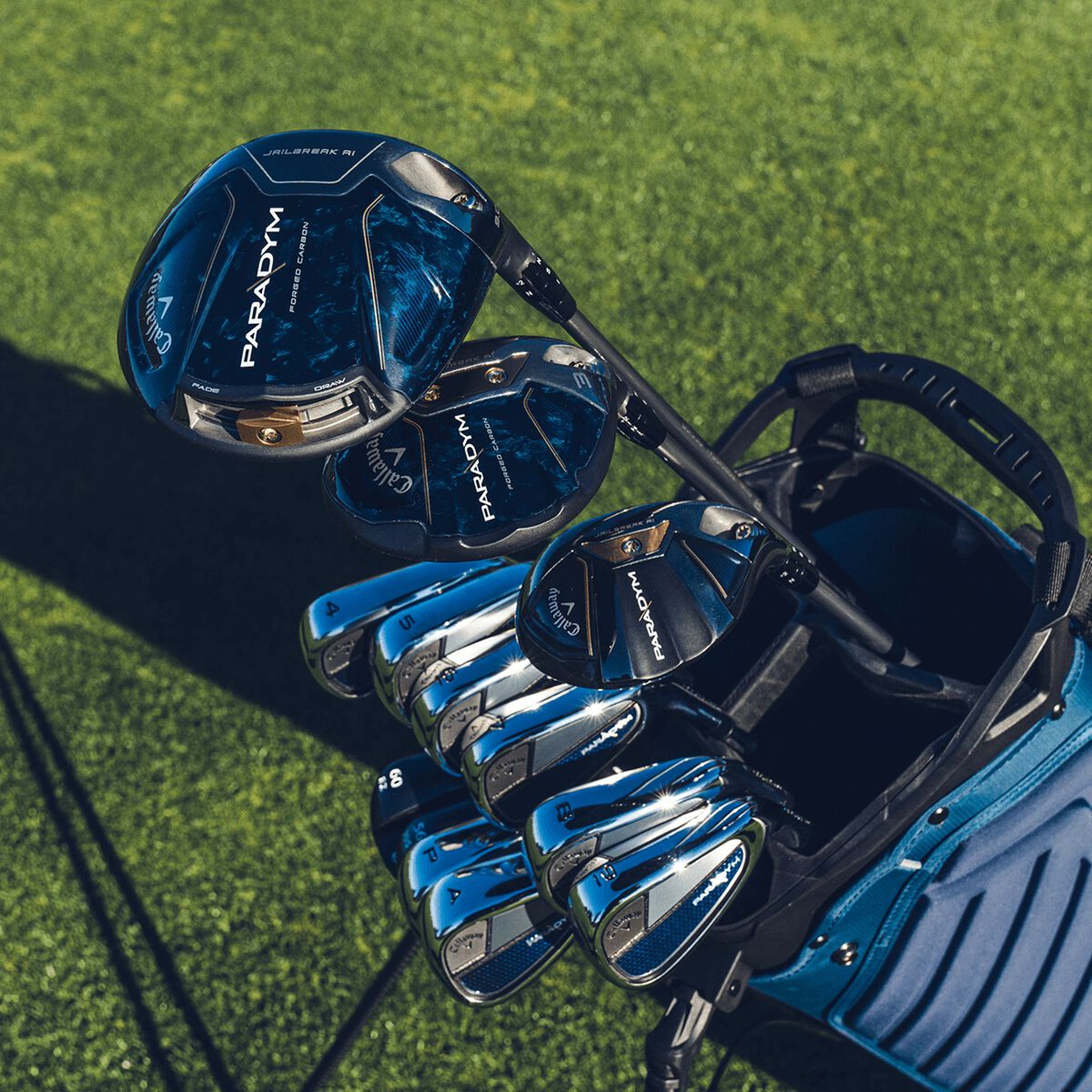 a full set of paradym golf clubs in a calalway gofl bag on a golf course