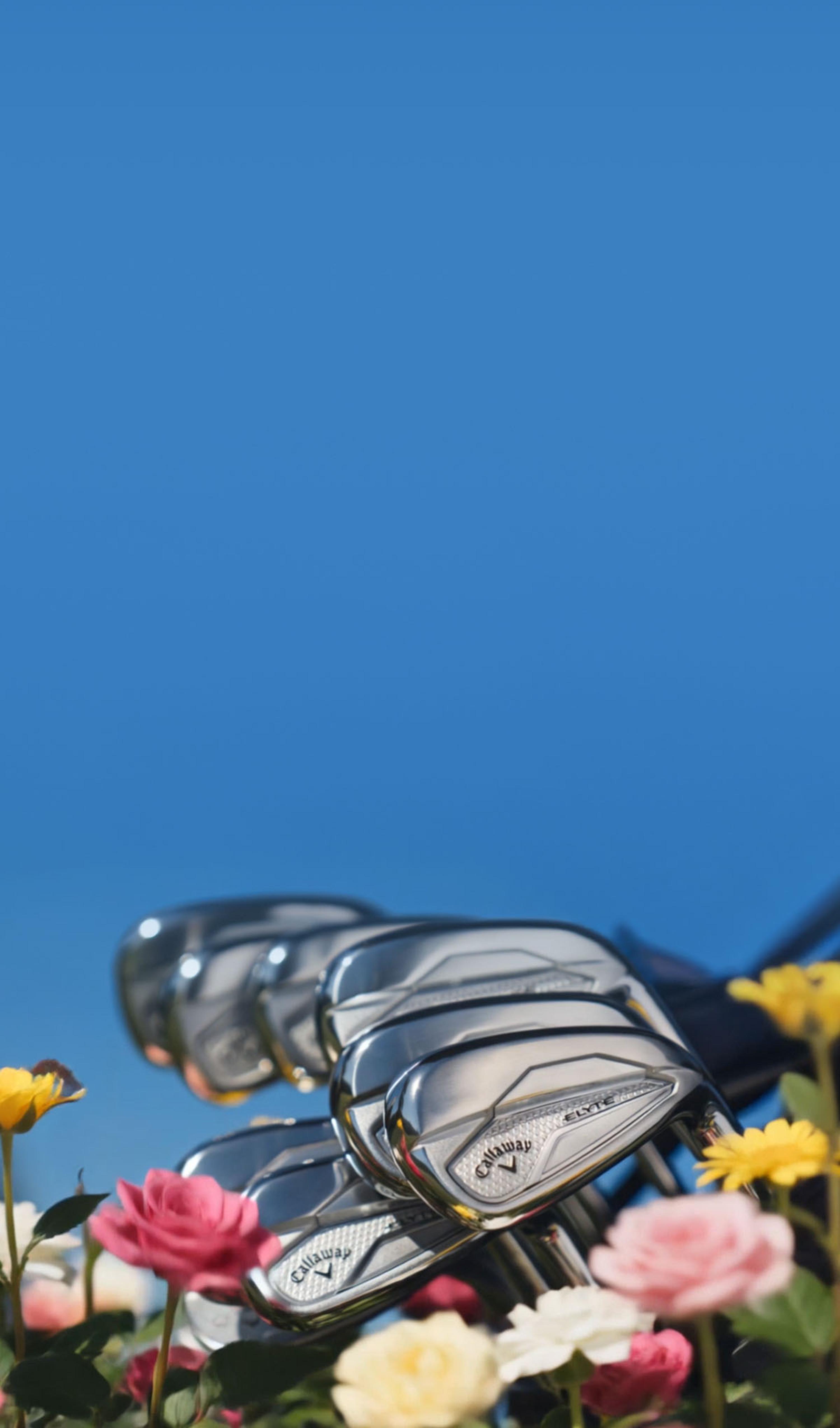 elyte iron club with flowers on turf