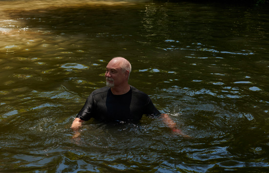 The photographer's father Steve swimming in the water.