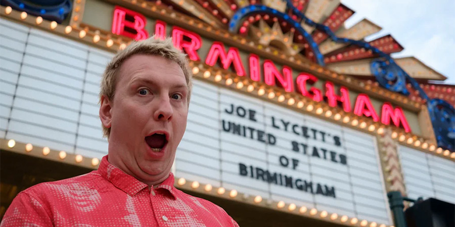 Man in front of a theatre